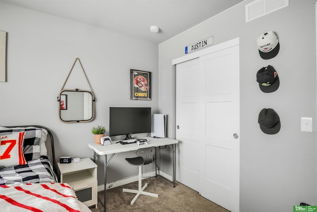 carpeted bedroom with baseboards and visible vents
