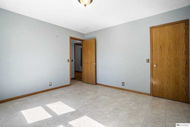 empty room featuring baseboards