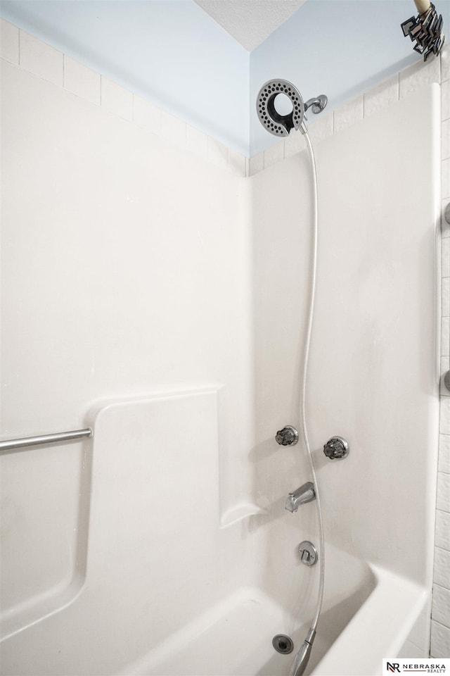 full bath featuring washtub / shower combination