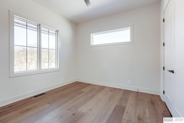 6511 Garvin St, Omaha, NE 68152 - empty room featuring baseboards, light wood-style floors, and visible vents