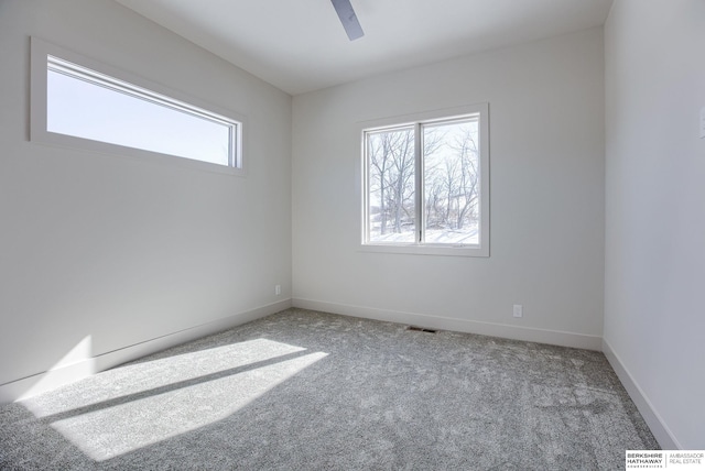 6511 Garvin St, Omaha, NE 68152 - carpeted spare room featuring ceiling fan, baseboards, and visible vents