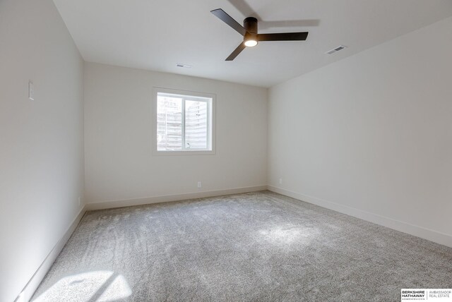 6511 Garvin St, Omaha, NE 68152 - unfurnished room featuring a ceiling fan, carpet flooring, visible vents, and baseboards
