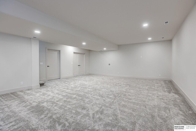 6511 Garvin St, Omaha, NE 68152 - finished basement with visible vents, carpet floors, and recessed lighting