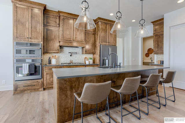 6511 Garvin St, Omaha, NE 68152 - kitchen with a sink, tasteful backsplash, recessed lighting, dark countertops, and appliances with stainless steel finishes