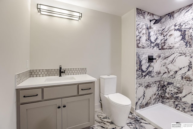 6511 Garvin St, Omaha, NE 68152 - bathroom featuring toilet, marble finish floor, vanity, decorative backsplash, and a shower