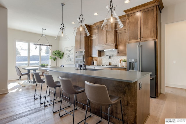 6511 Garvin St, Omaha, NE 68152 - kitchen with decorative backsplash, stainless steel appliances, baseboards, and recessed lighting