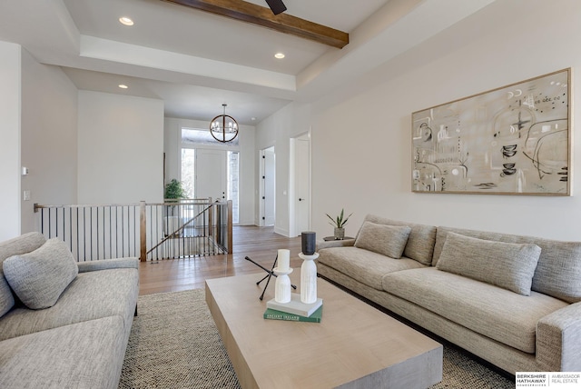 6511 Garvin St, Omaha, NE 68152 - living room featuring recessed lighting, beam ceiling, wood finished floors, and a notable chandelier