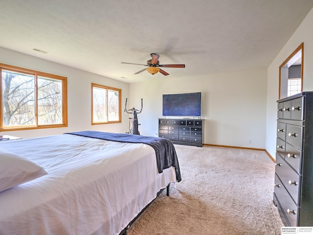 bedroom featuring ceiling fan, carpet flooring, baseboards, and visible vents