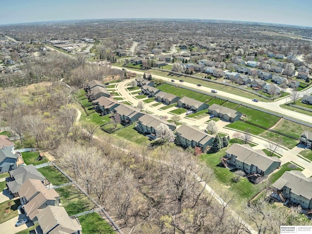 birds eye view of property with a residential view