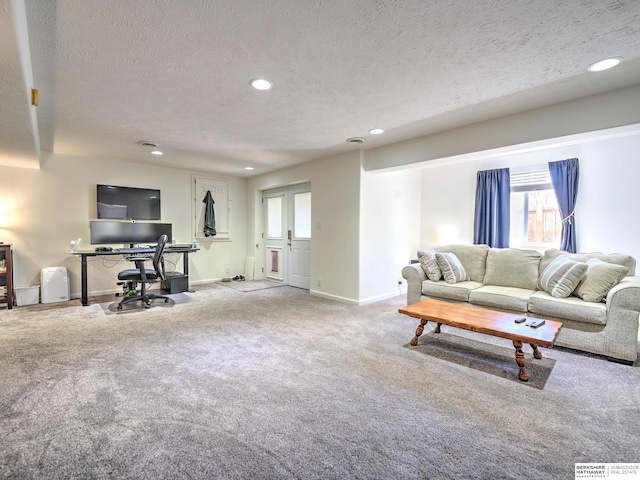 living area with a wealth of natural light, recessed lighting, carpet flooring, and a textured ceiling