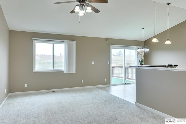 2857 Ravae Ln, Blair, NE 68008 - spare room with lofted ceiling, ceiling fan, baseboards, and carpet floors