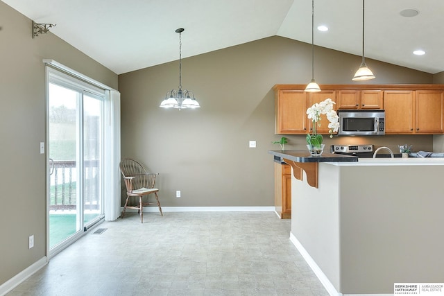 2857 Ravae Ln, Blair, NE 68008 - kitchen with visible vents, a healthy amount of sunlight, vaulted ceiling, and stainless steel appliances
