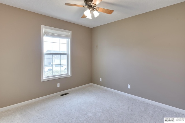 2857 Ravae Ln, Blair, NE 68008 - carpeted spare room with visible vents, baseboards, and a ceiling fan