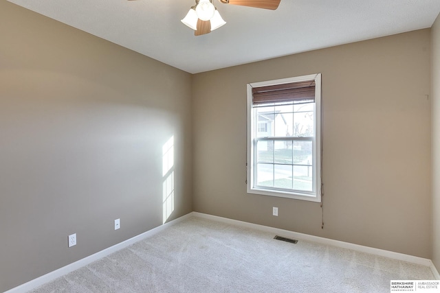2857 Ravae Ln, Blair, NE 68008 - spare room with visible vents, ceiling fan, baseboards, and light carpet