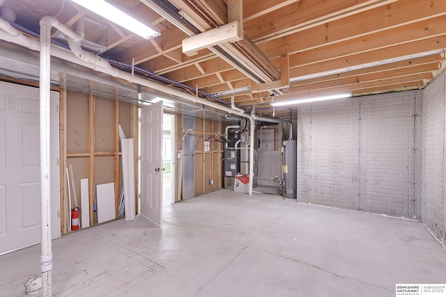 2857 Ravae Ln, Blair, NE 68008 - below grade area featuring gas water heater, heating unit, and brick wall