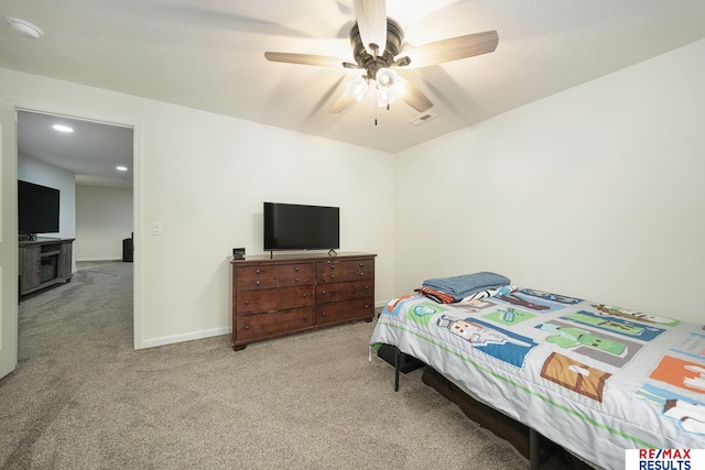 bedroom with visible vents, baseboards, carpet flooring, and ceiling fan