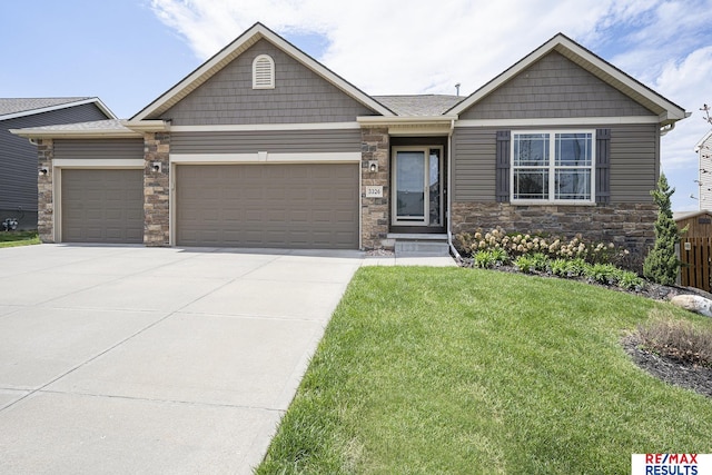 craftsman house featuring an attached garage, stone siding, a front lawn, and concrete driveway