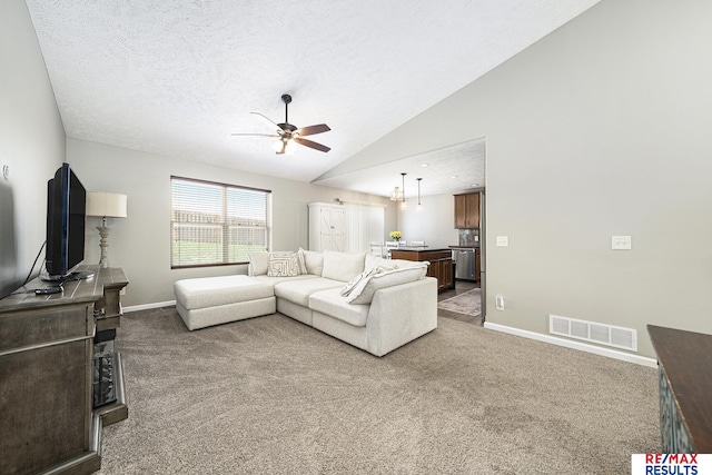 living area with vaulted ceiling, baseboards, visible vents, carpet, and ceiling fan