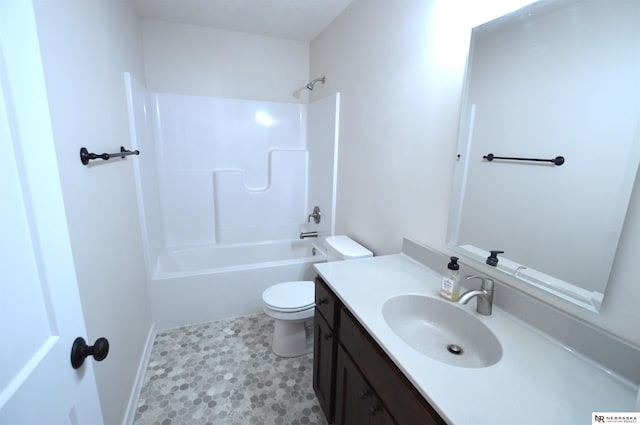 bathroom featuring toilet, vanity, and bathing tub / shower combination