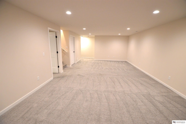 finished below grade area featuring recessed lighting, carpet flooring, and baseboards