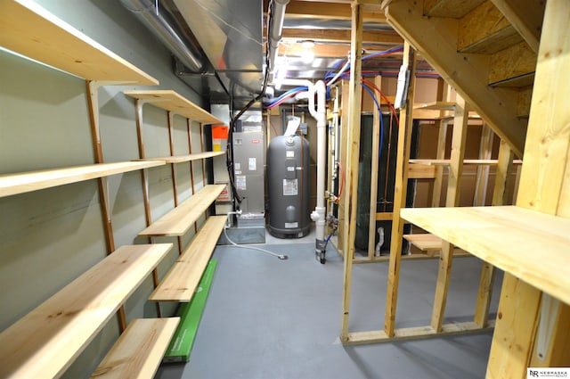 unfinished basement with stairway and heat pump water heater