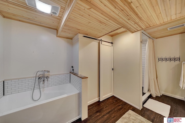 full bath featuring wood ceiling, a garden tub, and wood finished floors