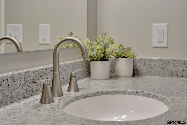 room details featuring a sink and decorative backsplash