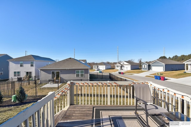 deck featuring a residential view and fence