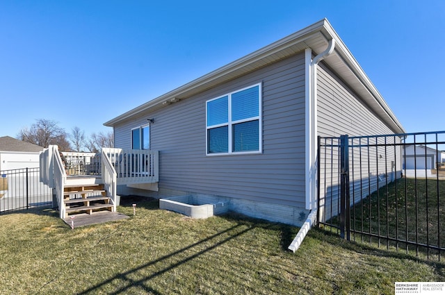 back of house featuring a yard, fence, and a deck