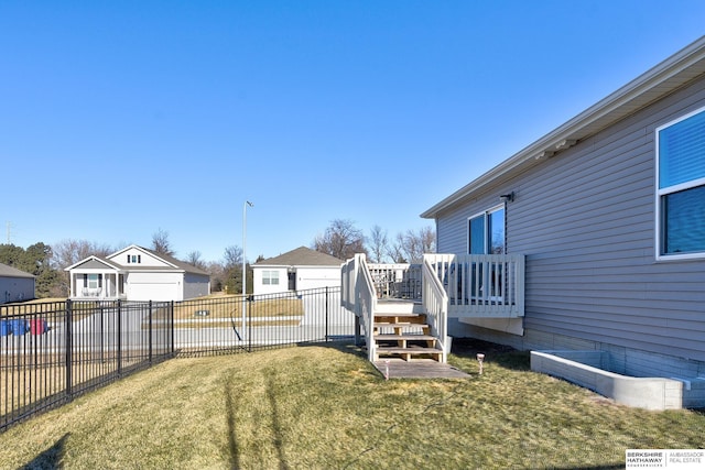 view of yard with fence and a wooden deck