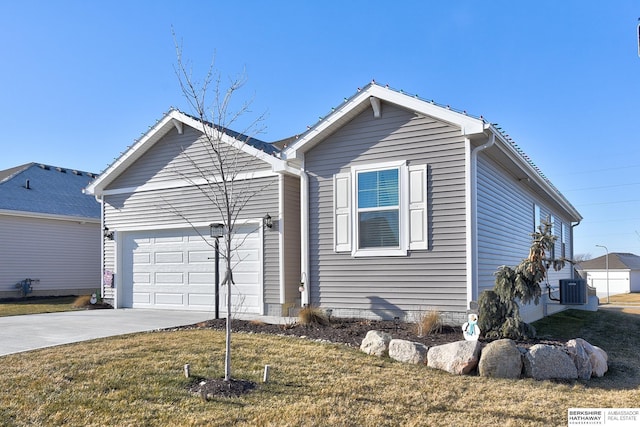view of front of property featuring central AC unit, driveway, an attached garage, and a front lawn