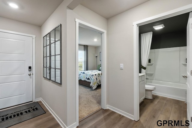 6308 Harvest Dr, Papillion, NE 68157 - doorway to outside featuring baseboards and wood finished floors