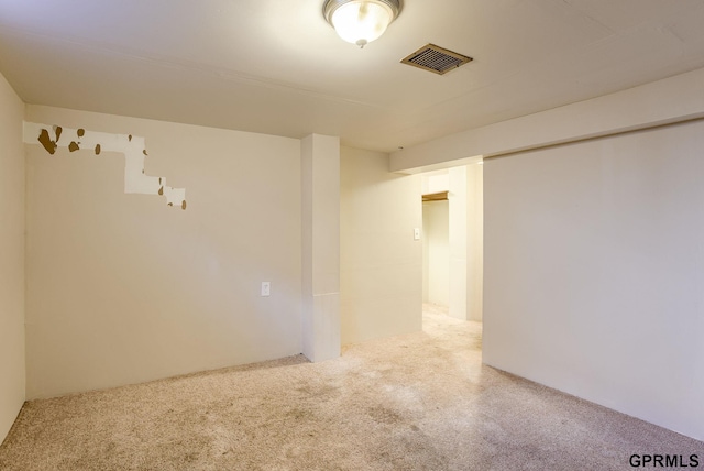 empty room with light carpet and visible vents