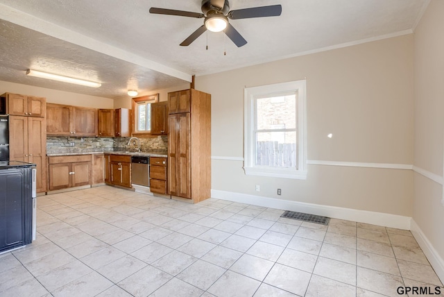 kitchen with tasteful backsplash, visible vents, brown cabinets, and light tile patterned flooring
