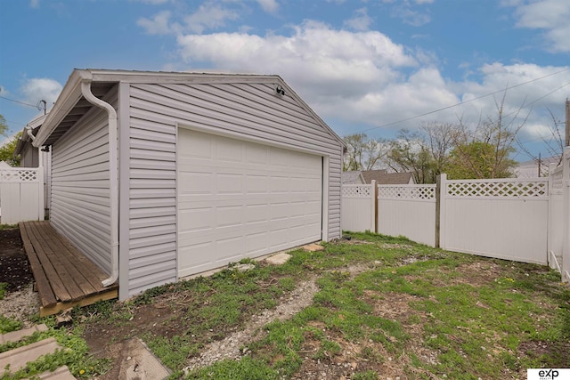 detached garage with fence