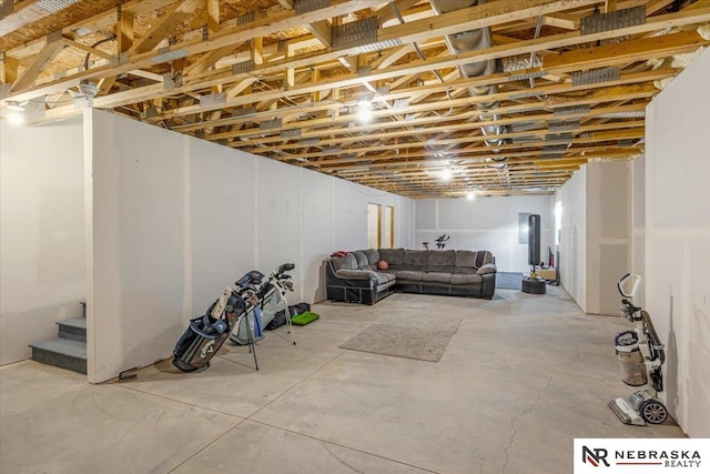 unfinished basement featuring stairs