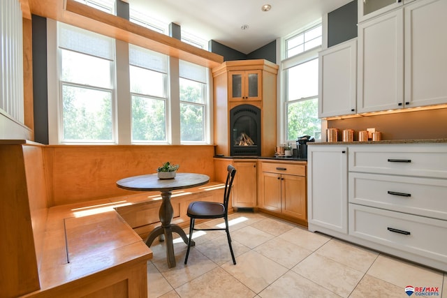 dining space featuring light tile patterned floors