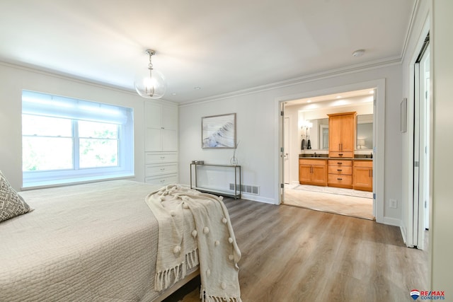bedroom with light wood-type flooring, baseboards, visible vents, and crown molding