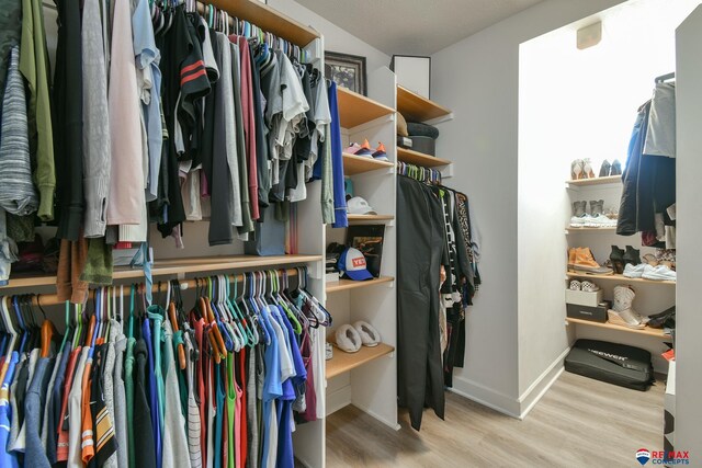 spacious closet with wood finished floors