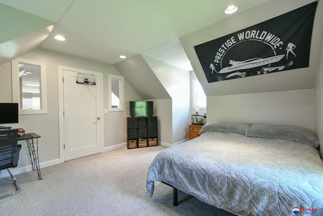 carpeted bedroom featuring recessed lighting, vaulted ceiling, and baseboards