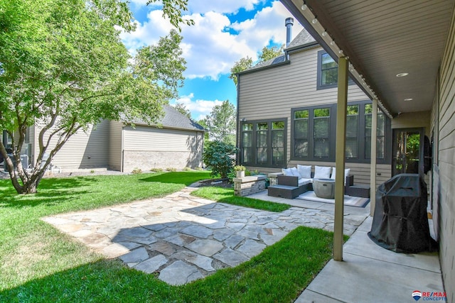 view of yard featuring an outdoor living space and a patio
