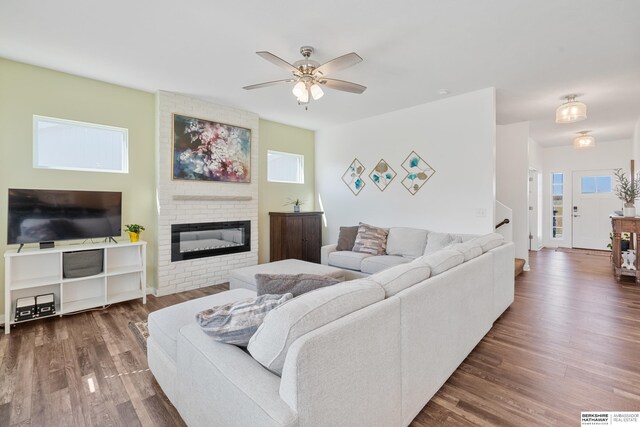 6315 N Hws Cleveland Blvd, Omaha, NE 68116 - living room with dark wood finished floors, a wealth of natural light, a large fireplace, and ceiling fan