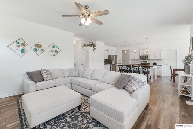 6315 N Hws Cleveland Blvd, Omaha, NE 68116 - living room featuring dark wood-type flooring, a ceiling fan, baseboards, and recessed lighting