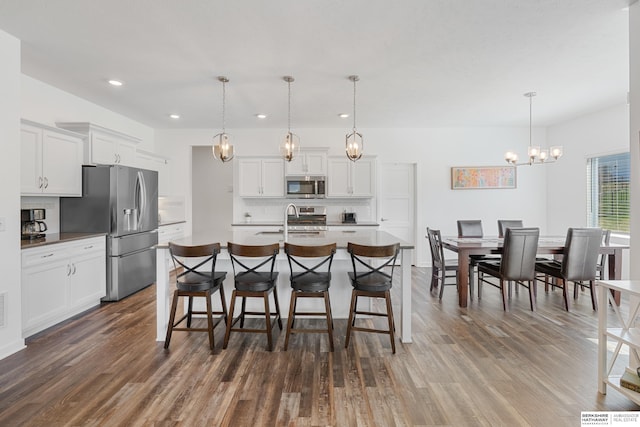 6315 N Hws Cleveland Blvd, Omaha, NE 68116 - dining space featuring an inviting chandelier, dark wood-style floors, and recessed lighting
