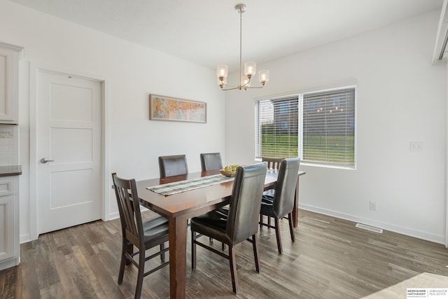 6315 N Hws Cleveland Blvd, Omaha, NE 68116 - dining space with a chandelier, wood finished floors, visible vents, and baseboards