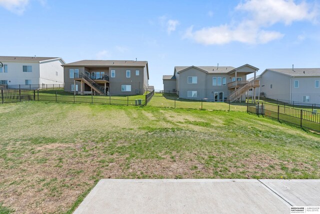 6315 N Hws Cleveland Blvd, Omaha, NE 68116 - view of yard featuring a fenced backyard, a residential view, and stairs