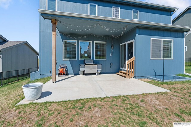 6315 N Hws Cleveland Blvd, Omaha, NE 68116 - back of property featuring fence, a yard, a patio, and entry steps