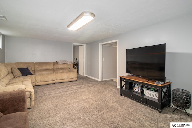 living area featuring carpet floors and baseboards
