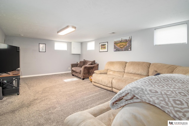 carpeted living room featuring baseboards and visible vents