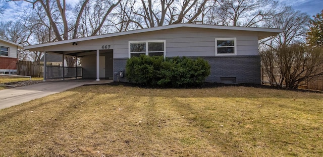 ranch-style house featuring brick siding, driveway, a front lawn, and a carport